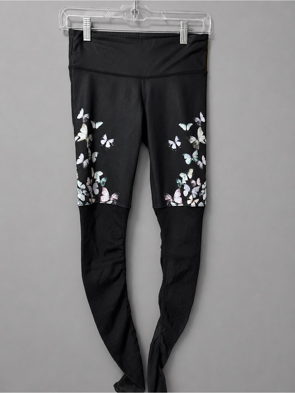 Alo Yoga Gypset Goddess leggings in a black and butterfly print.